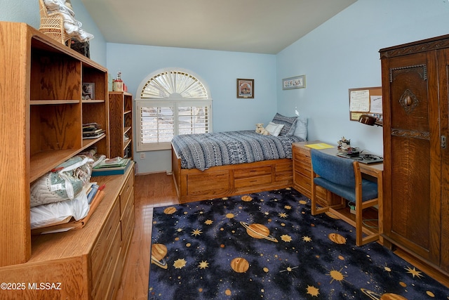 bedroom with lofted ceiling