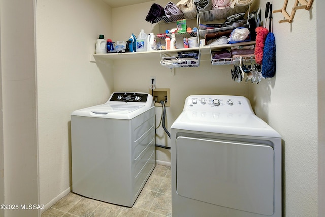 clothes washing area with independent washer and dryer