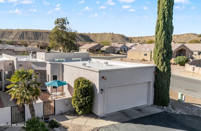 birds eye view of property with a mountain view