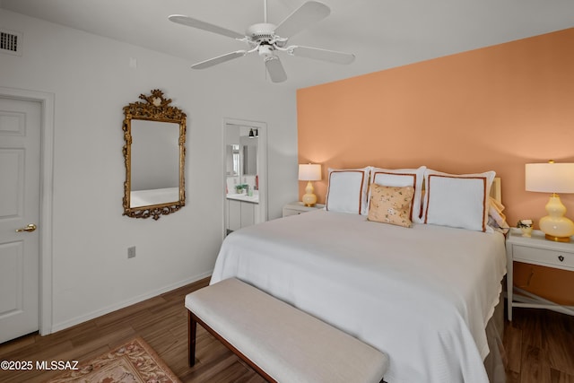 bedroom with ceiling fan and dark hardwood / wood-style floors