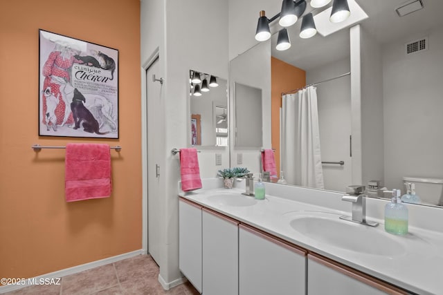 bathroom with vanity and tile patterned floors