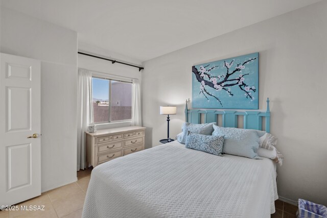 bedroom featuring ceiling fan, access to exterior, and dark hardwood / wood-style flooring