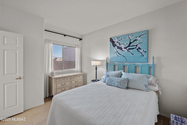 bedroom featuring light tile patterned floors