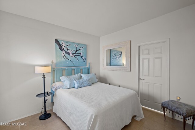 bedroom featuring dark hardwood / wood-style floors, ceiling fan, and access to exterior