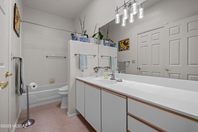 full bathroom featuring tile patterned flooring, vanity, tiled shower / bath combo, and toilet