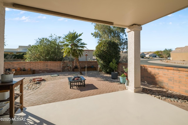 view of patio featuring an outdoor fire pit