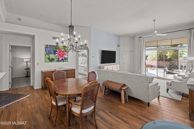 dining room featuring hardwood / wood-style floors and a chandelier