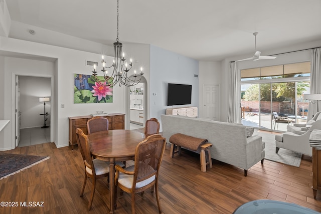 dining area featuring wood-type flooring and a notable chandelier