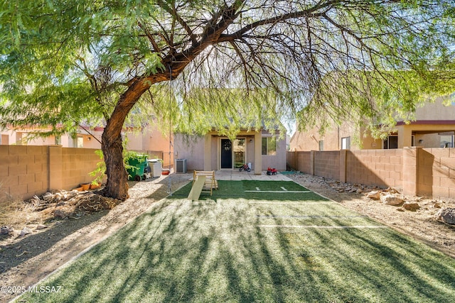 view of yard with central AC