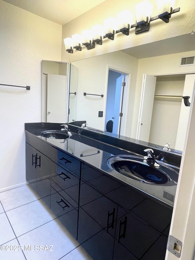 bathroom with vanity and tile patterned floors