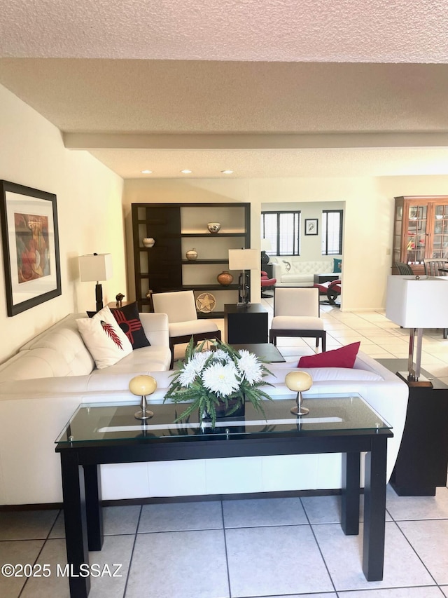 tiled living room with a textured ceiling