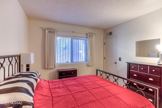 bedroom with a textured ceiling