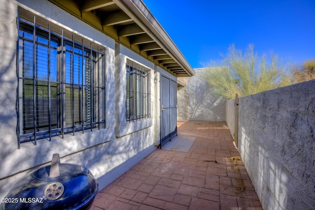 view of property exterior featuring a patio area