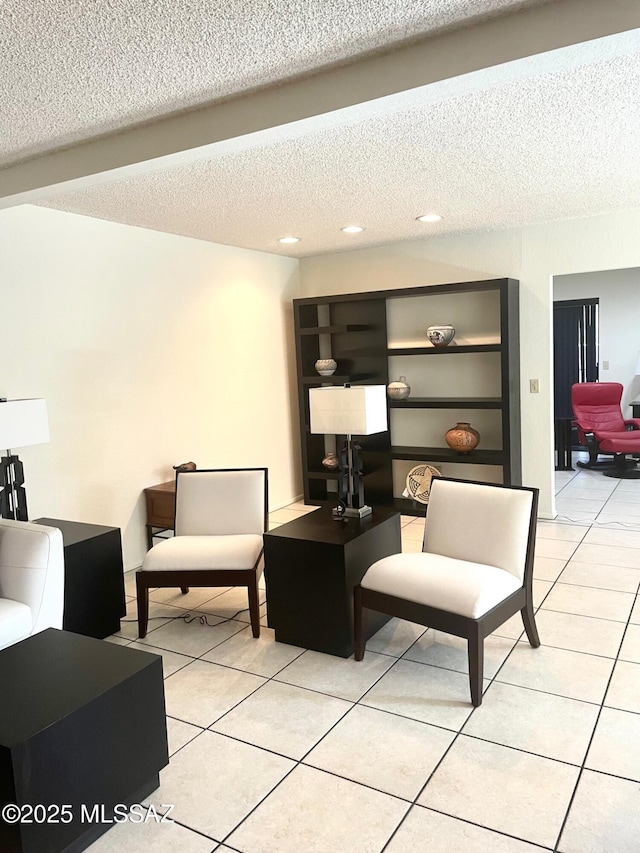 tiled living room with a textured ceiling