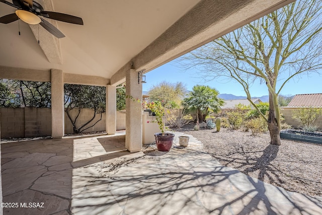 view of patio featuring a ceiling fan and a fenced backyard