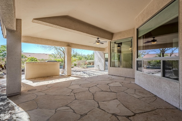 view of patio featuring ceiling fan