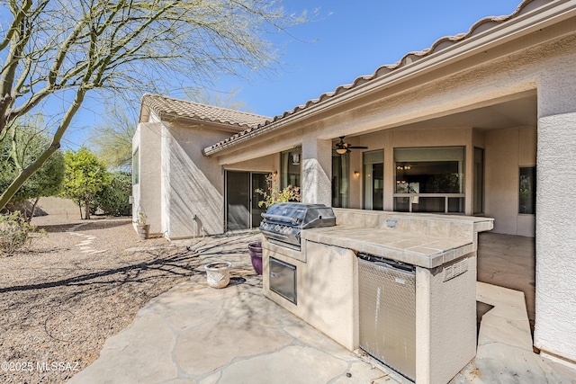 view of patio with a grill and exterior kitchen