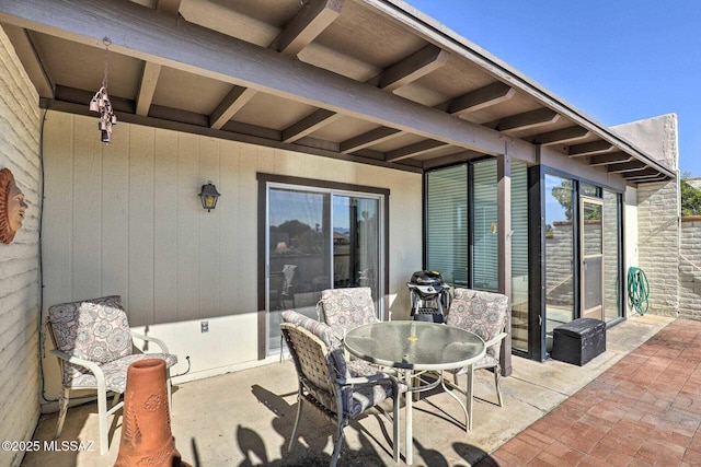 view of patio featuring outdoor dining area