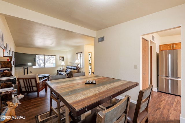 dining room featuring dark hardwood / wood-style flooring