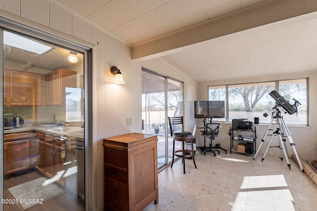 office area with crown molding and sink