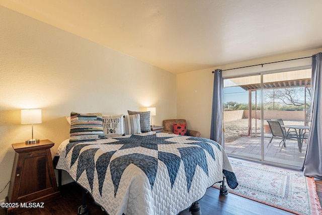 bedroom featuring dark hardwood / wood-style floors and access to exterior