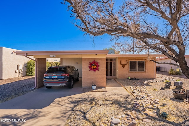 ranch-style home with a carport