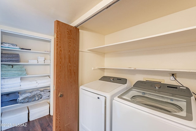 laundry room with dark hardwood / wood-style floors and washer and clothes dryer