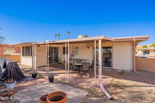 rear view of property featuring a patio