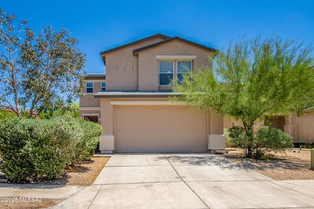 view of front of property featuring a garage