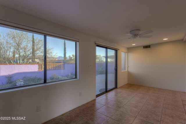 doorway to outside with light tile patterned floors and ceiling fan