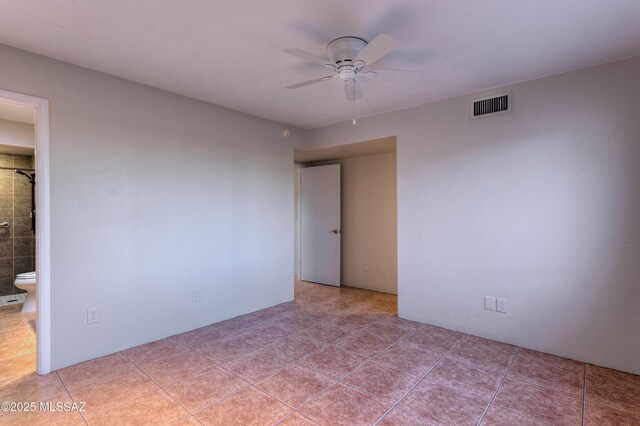 bathroom featuring tile patterned flooring, vanity, a shower with shower curtain, and toilet