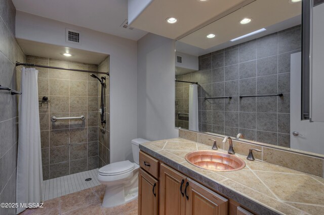 bathroom featuring vanity, curtained shower, and toilet