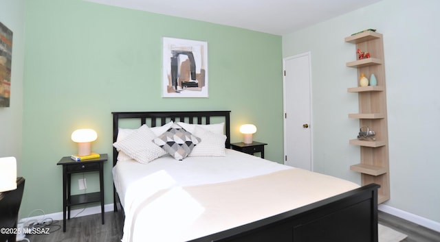 bedroom featuring dark hardwood / wood-style flooring