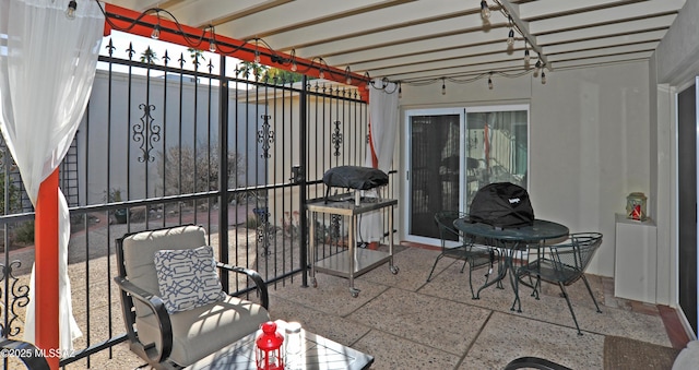 view of patio / terrace with a balcony