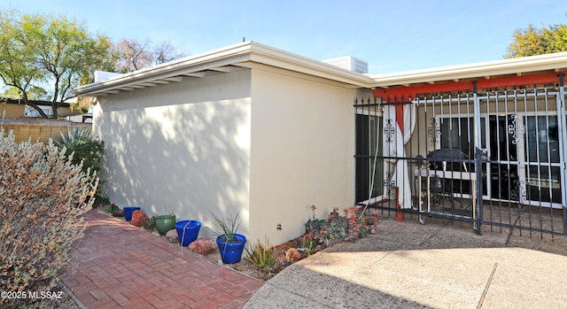 view of property exterior featuring a patio