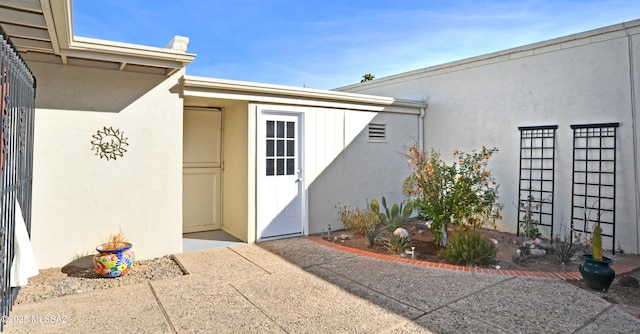 doorway to property featuring a patio area