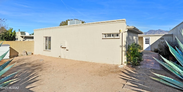 rear view of property with a mountain view