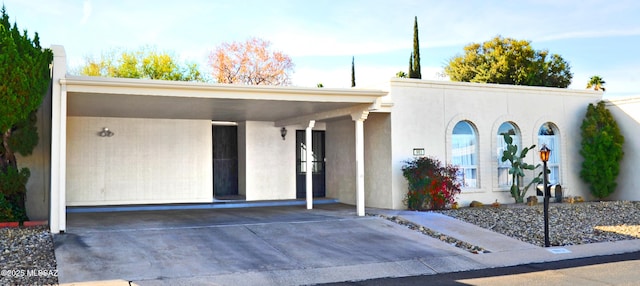 view of front of home featuring a carport