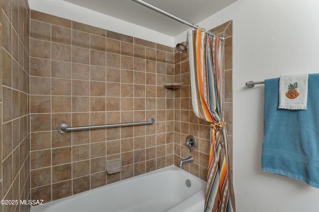 bathroom featuring shower / bath combo with shower curtain