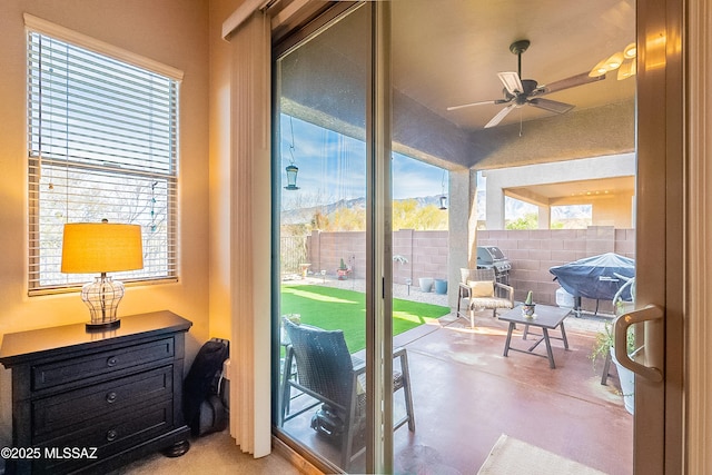 entryway featuring ceiling fan