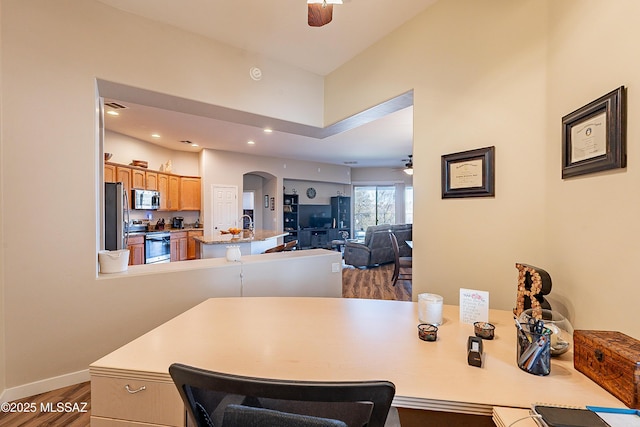 13774 N High Mountain View Pl, Tucson, AZ 85739 - dining area with ceiling fan, arched walkways, wood finished floors, and recessed lighting