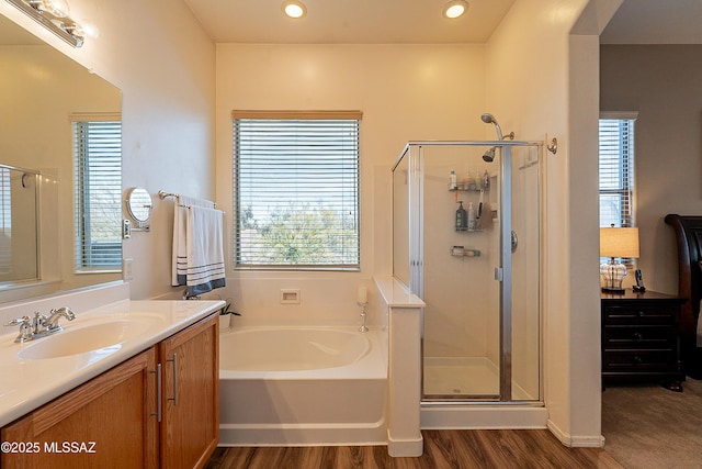 13774 N High Mountain View Pl, Tucson, AZ 85739 - bathroom with wood finished floors, a garden tub, vanity, a stall shower, and recessed lighting