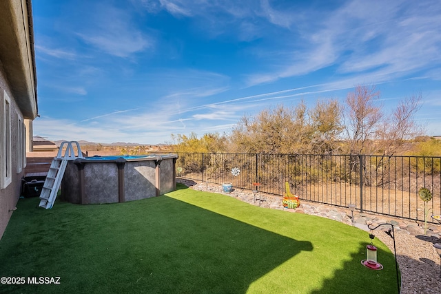 view of yard featuring a fenced in pool