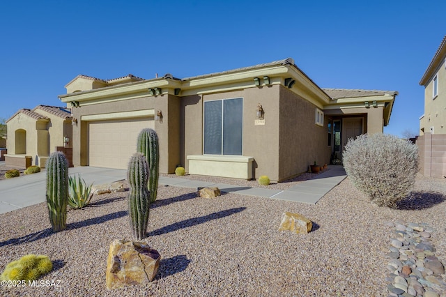 13774 N High Mountain View Pl, Tucson, AZ 85739 - view of front facade featuring stucco siding, a garage, driveway, and a tile roof