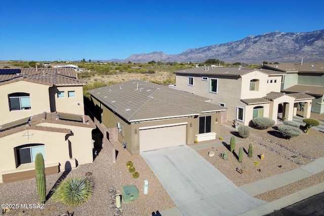 13774 N High Mountain View Pl, Tucson, AZ 85739 - mediterranean / spanish-style home featuring an attached garage, stucco siding, concrete driveway, and a mountain view