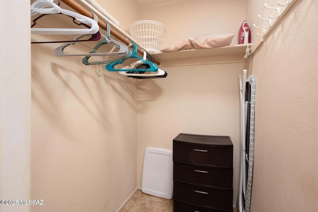 walk in closet featuring light tile patterned floors