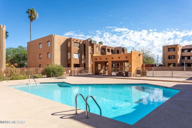 view of swimming pool with a patio