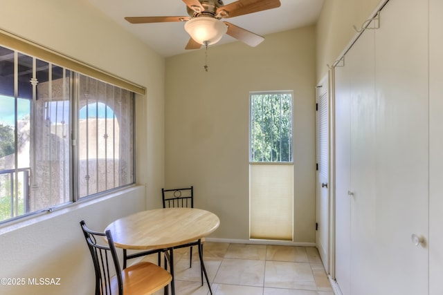 dining area featuring light tile patterned floors and ceiling fan