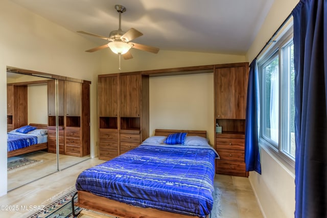 tiled bedroom with vaulted ceiling and ceiling fan