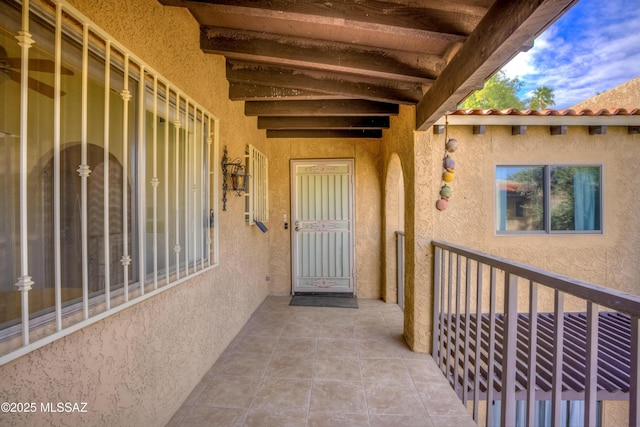 property entrance featuring a patio area